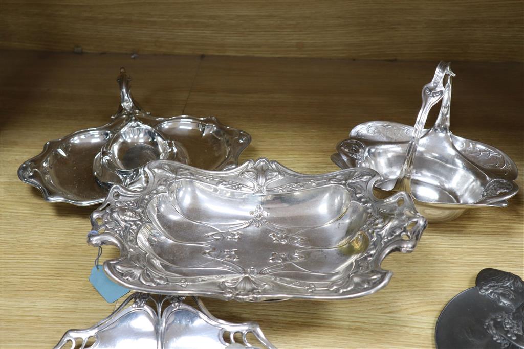 A WMF inkstand, 26cm wide, WMF plaque embossed with a young girl, and three Art Nouveau silver plated serving dishes (5)